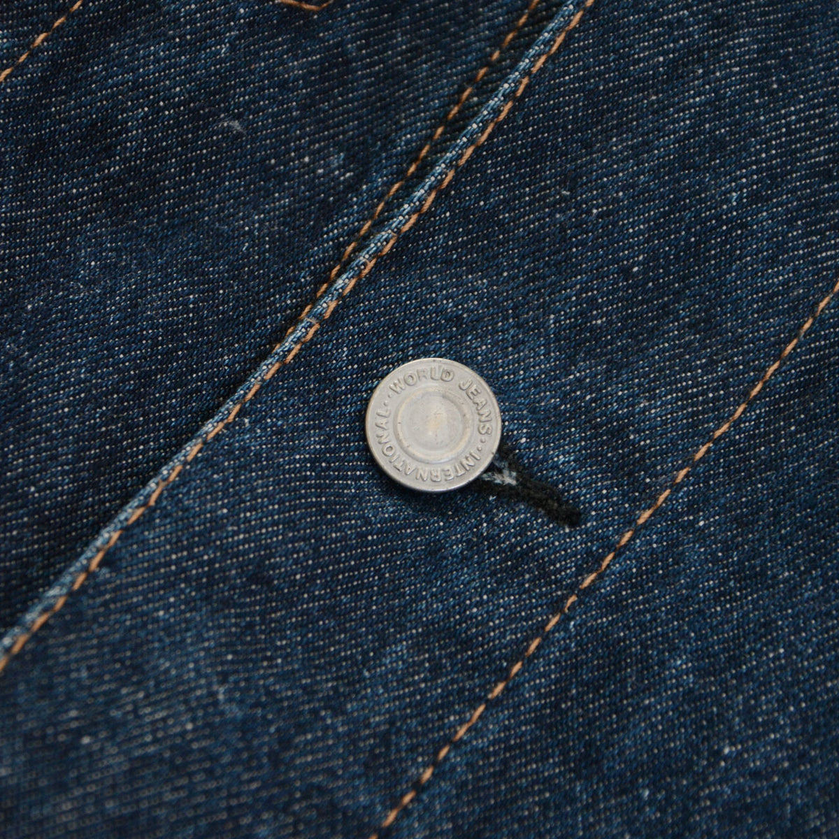 UNIQLO denim jacket metal button with WORLD JEANS INTERNATIONAL lettering